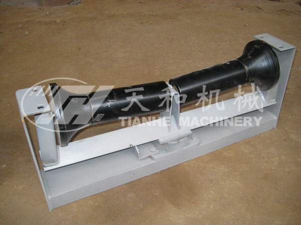 Return friction self-aligning idler